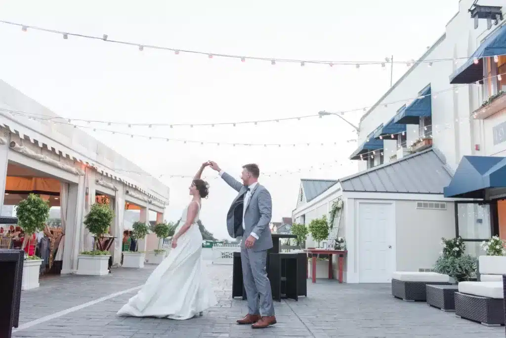 bride and groom dancing on the patio at The Regatta Place